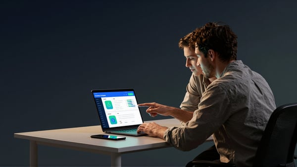 A small-business colleague using an AI assistant dashboard on a laptop