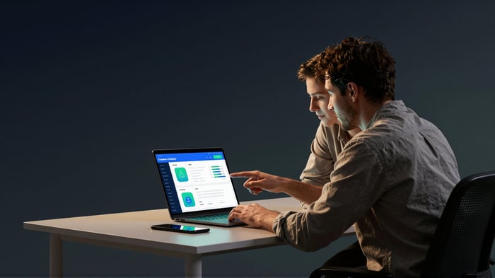 A small-business colleague using an AI assistant dashboard on a laptop